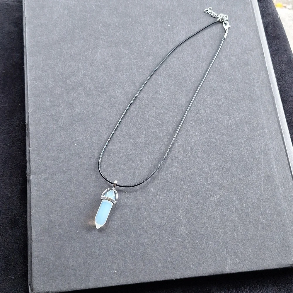 Clear crystal point pendant necklace on 16-inch faux leather chain